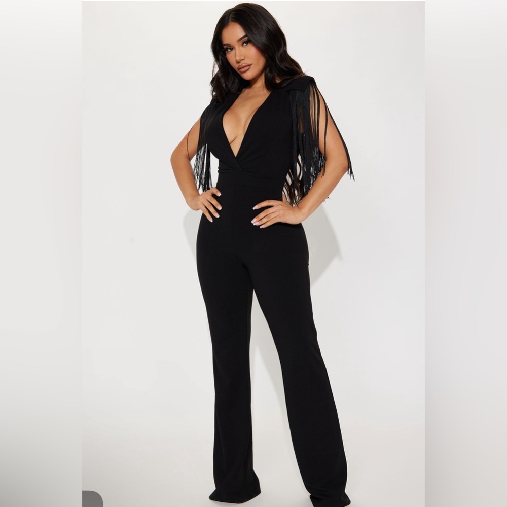 Black jumpsuit , fringe detail on shoulders.